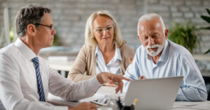 Older couple meeting with a financial advisor.