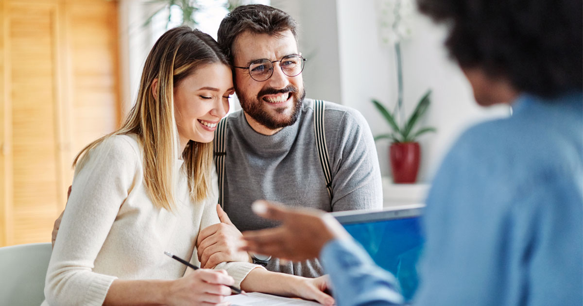 A Young Couple Meeting with an Advisor