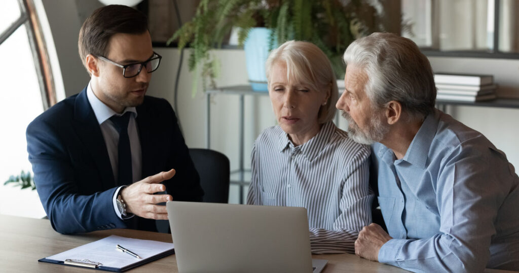 Concerned Older Couple With Their Advisor