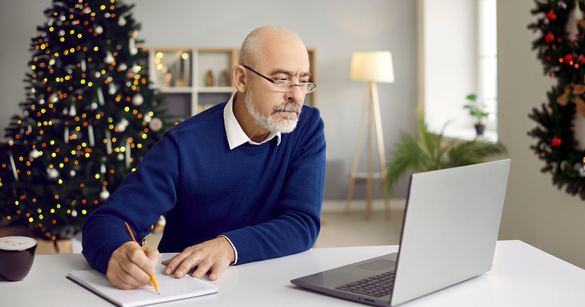 A Man on His Computer During the Holiday Season