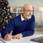 A Man on His Computer During the Holiday Season