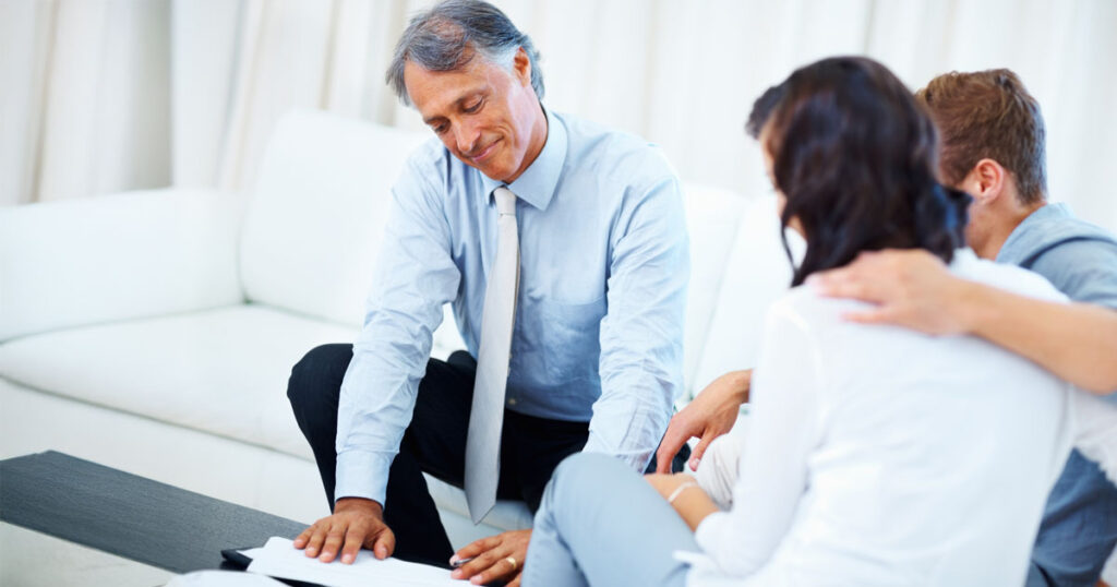 Advisor helping couple understand market downturn.
